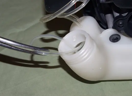 PHOTO: Fish the fuel filter from the fuel tank.