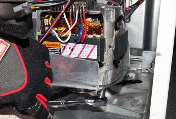 PHOTO: Release the motor mounting nuts.