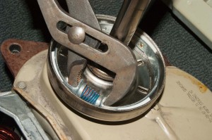 PHOTO: Compress the clutch band spring.