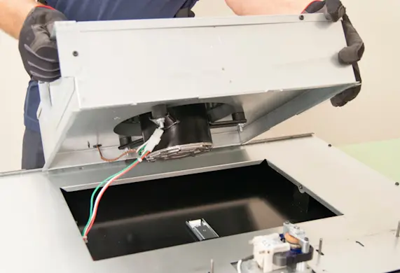 PHOTO: Tilt the blower housing up.