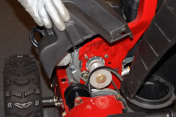 PHOTO: Remove the belt cover.
