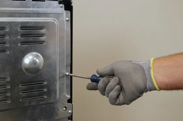 PHOTO: Remove the screws from the upper back panel.