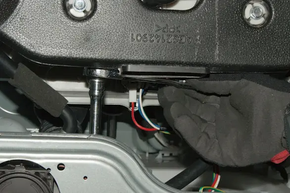 PHOTO: Remove the pump body mounting bolts.