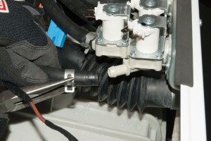 PHOTO: Pull the hoses off the water inlet valve.