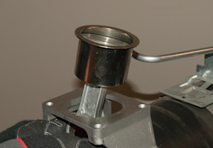 Push the piston and sleeve up and out of the pump body.