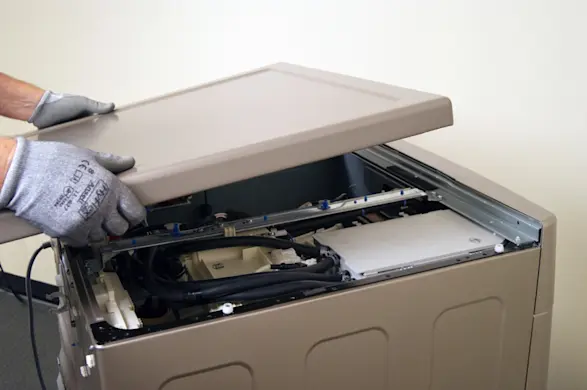 PHOTO: Remove the washer top panel.