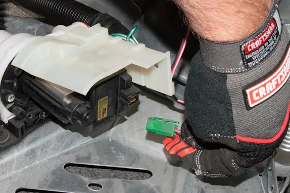 PHOTO: Disconnect the wires from the washer drain pump.