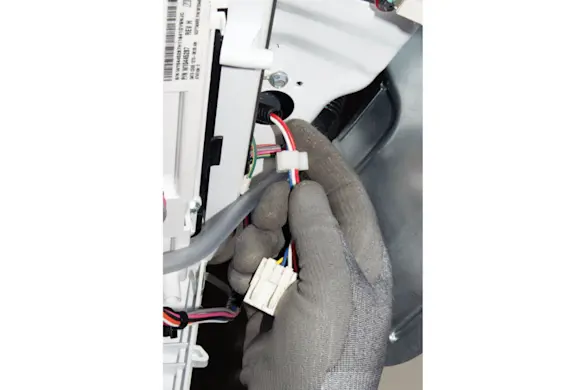 PHOTO: Thread the wire harness the the hold in the back of the top panel.