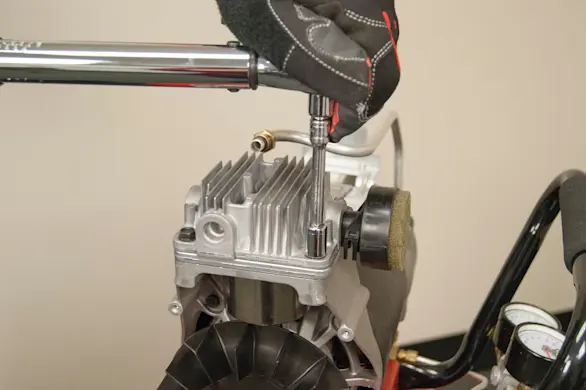 PHOTO: Install the pump head bolts and tighten.