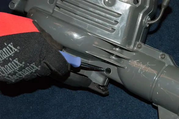 PHOTO: Remove the right side blower housing screws.