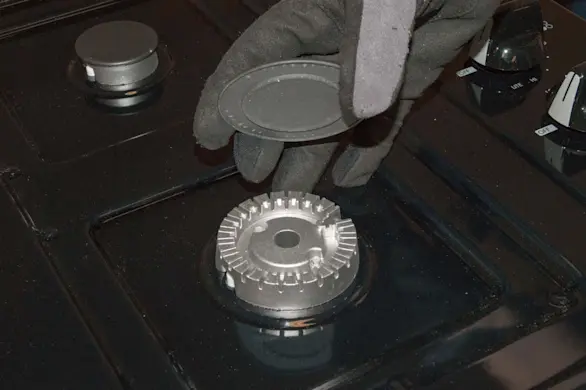 PHOTO: Reinstall the burner caps.