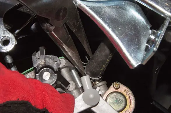 PHOTO: Connect the fuel line to the new carburetor.