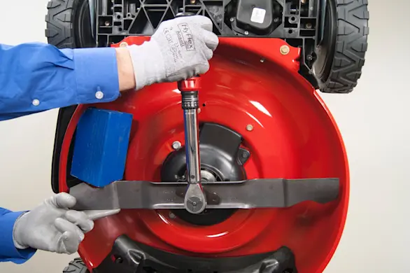 PHOTO: Reinstall the lawn mower blade.