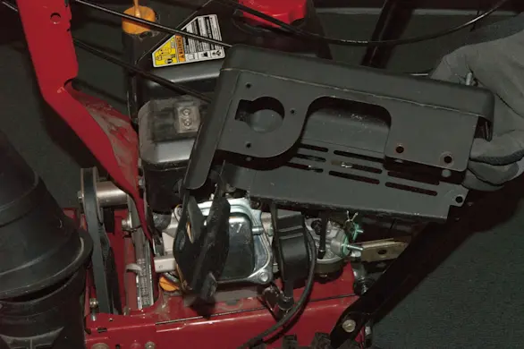 PHOTO: Remove the muffler shroud.
