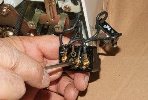 PHOTO: Remove the on/off switch wires from the terminal block.