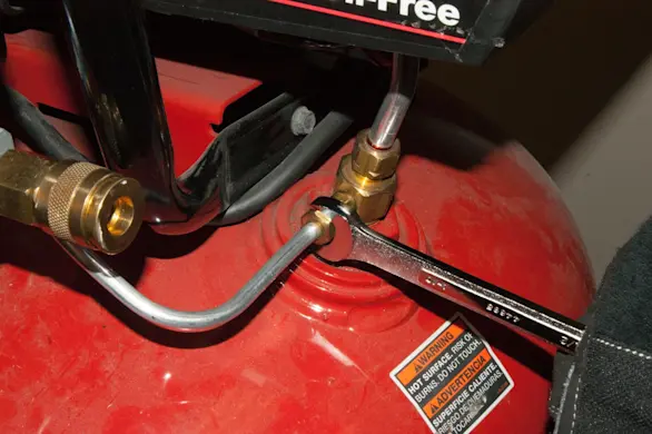 PHOTO: Reconnect the pressure switch tube.