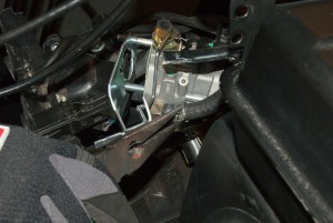PHOTO: Connect the new fuel line to the carburetor and secure it with the clamp.