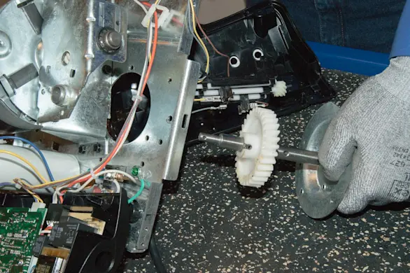 PHOTO: Reinstall the gear and sprocket assembly.