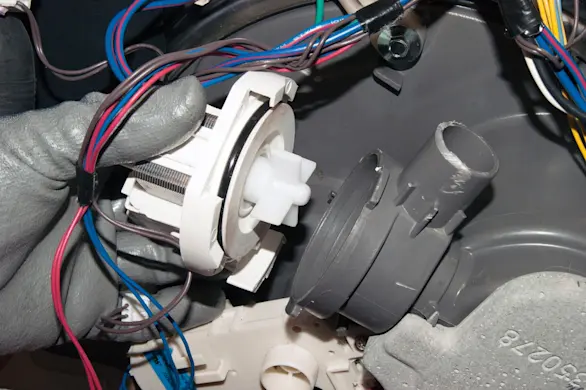 PHOTO: Reinstall the drain pump.