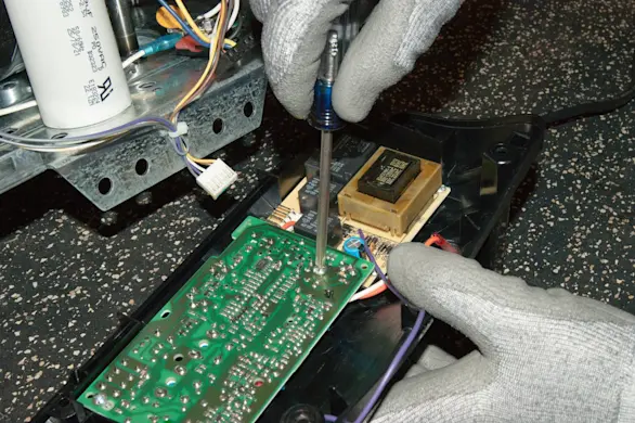 PHOTO: Install the new logic board.