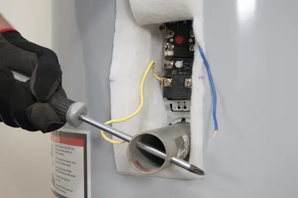 PHOTO: Unscrew the heating element.