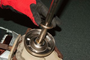 PHOTO: Remove the thrust washer from the transmission shaft.