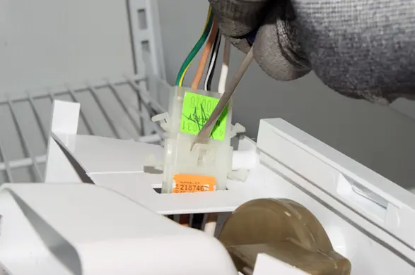 PHOTO: Release the wire harness locking tab.