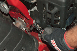 Remove the muffler shroud bolts.