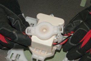 PHOTO: Reinstall the fan motor retainer.