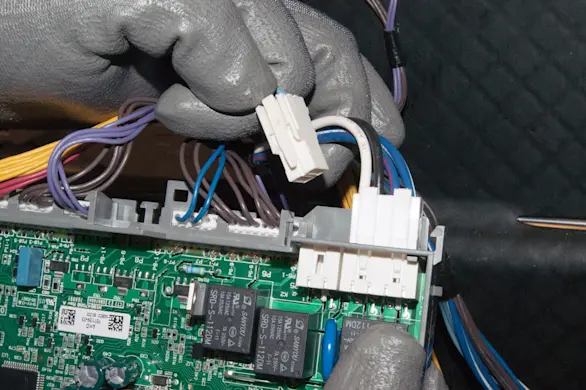 PHOTO: Connect the wires to the new electronic control board.