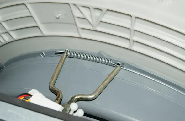 PHOTO: Reinstall the boot inner spring clamp.