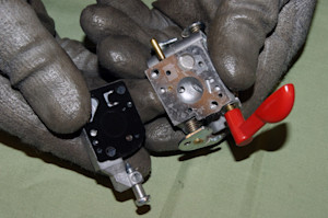 Remove the top cover and primer bulb.