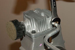 Reinstall the outlet tube to the pump head and tighten.