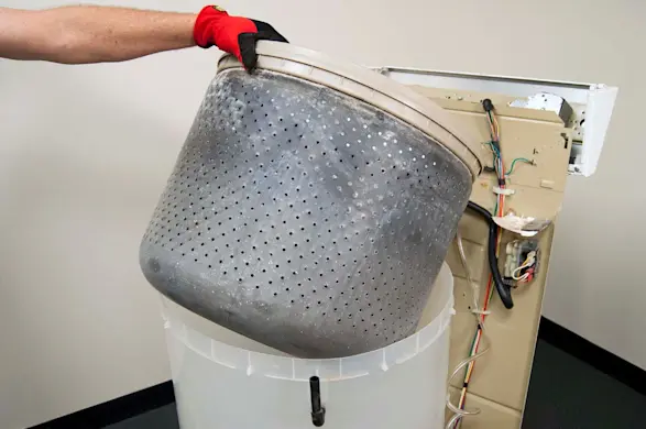 PHOTO: Lift the spin basket out of the tub.