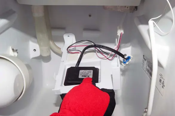 PHOTO: Pull the recirculation pump and bracket out.