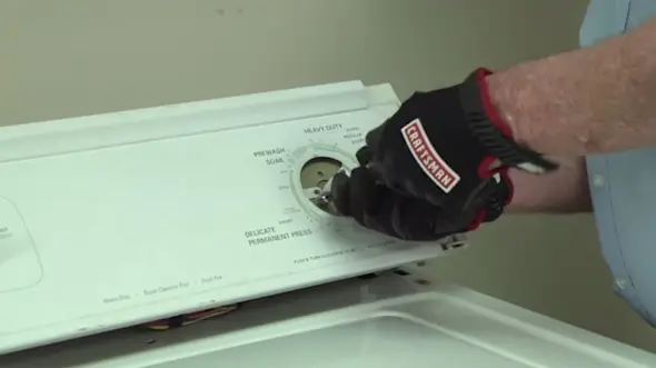 PHOTO: Remove the timer mounting screws.