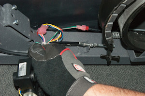 Slide the cable into the frame bracket.