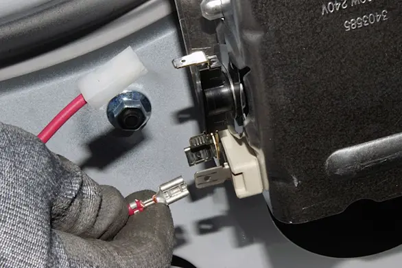 PHOTO: Pull the wires off the heating element.