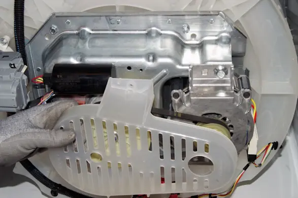 PHOTO: Remove the plastic motor cover.