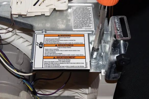 PHOTO: Remove the junction box cover.