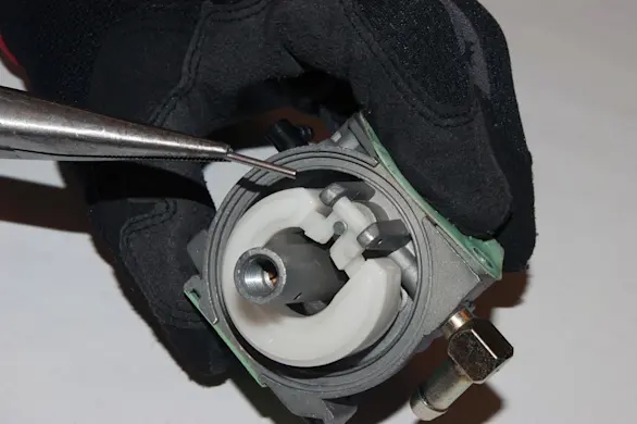 PHOTO: Remove the float pin.