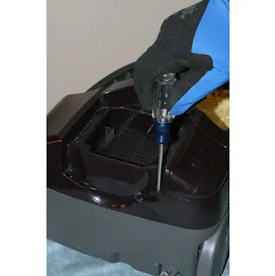 PHOTO: Remove the motor cover screws.