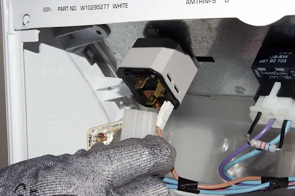 PHOTO: Remove the wires from the push-to-start switch.