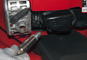 Install the new spark plug.