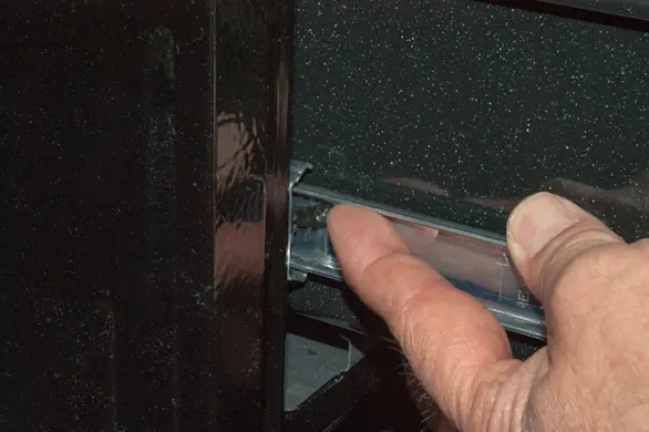 PHOTO: Push the left release lever up.