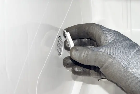 PHOTO: Remove the plastic water inlet nut.