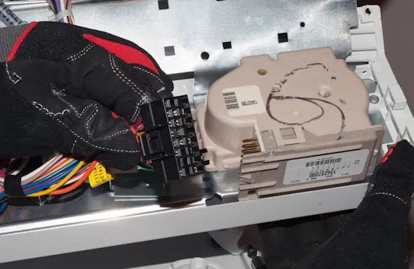 PHOTO: Reconnect the timer wire harness.