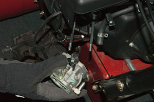 Remove the carburetor from the snowblower engine.