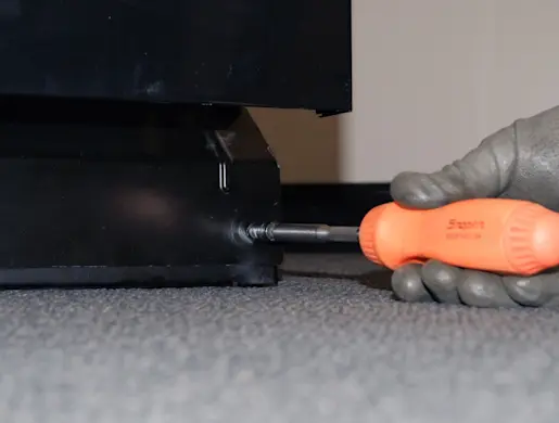 PHOTO: Remove the bottom front access panel screws.