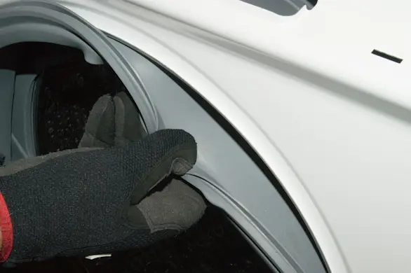 PHOTO: Reinstall the door boot.